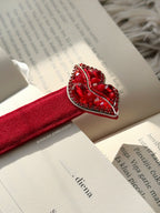 Red lips shaped bookmark on an open diary
