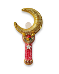 gold embroidered crescent moon with pink stick and quartz crystal