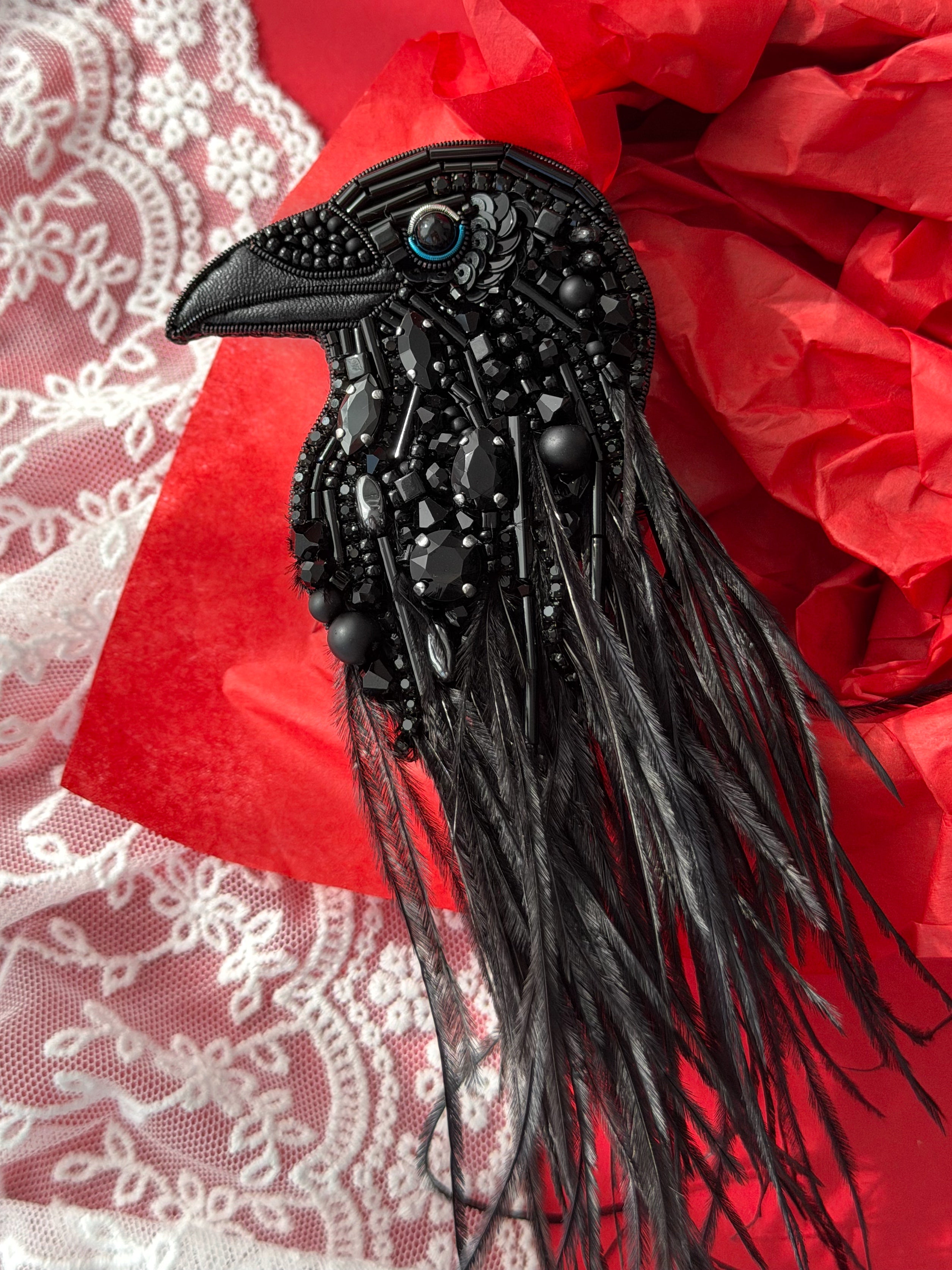 Hand embroidered black raven brooch with black glass beads and crystals, and black ostrich feathers. A bold gothic statement accessory, perfect for jackets, coats, and dark academia style lovers.