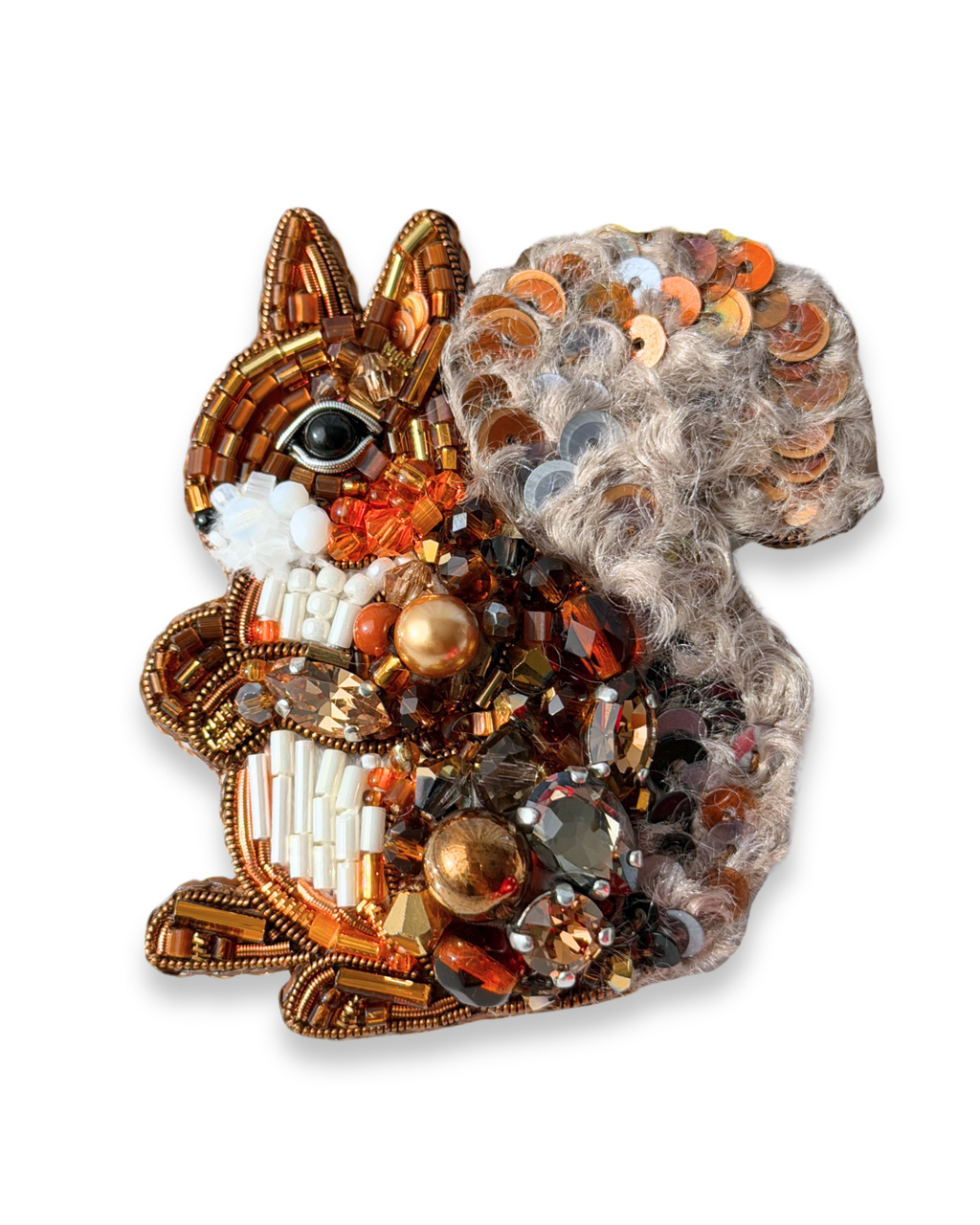 Decorative brooch shaped like a squirrel with beads and sequins on a white background