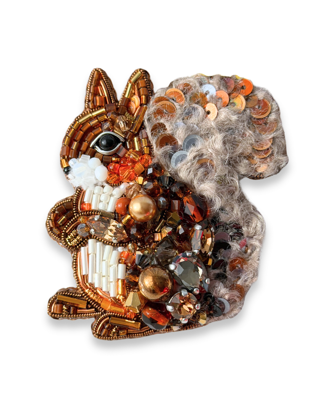 Decorative brooch shaped like a squirrel with beads and sequins on a white background