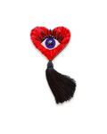 Heart-shaped brooch with an eye design and black hanging tassel.
