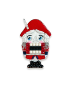 Nutcracker brooch with red hat and traditional attire.